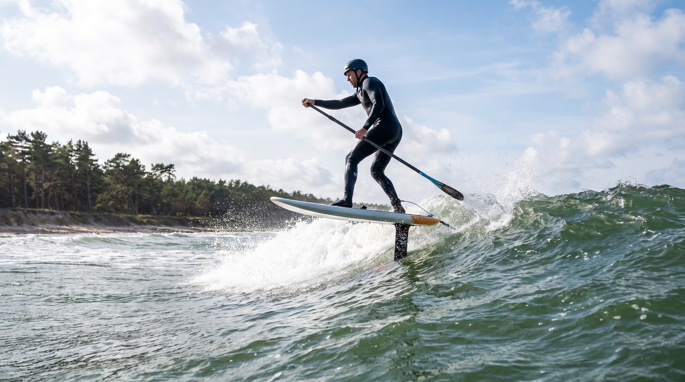 SUP foiling on the Baltic , up on the foil with a paddle